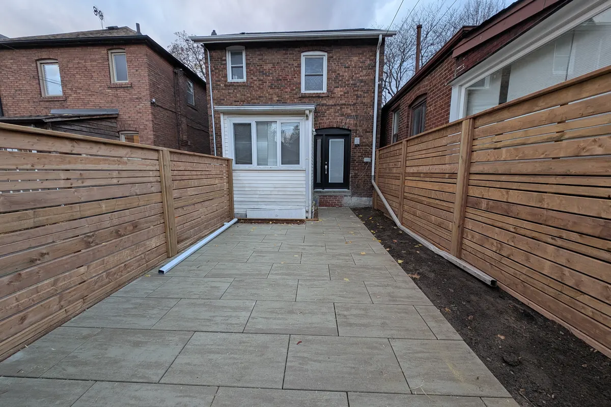 New horizontal board fence along a Toronto walkway