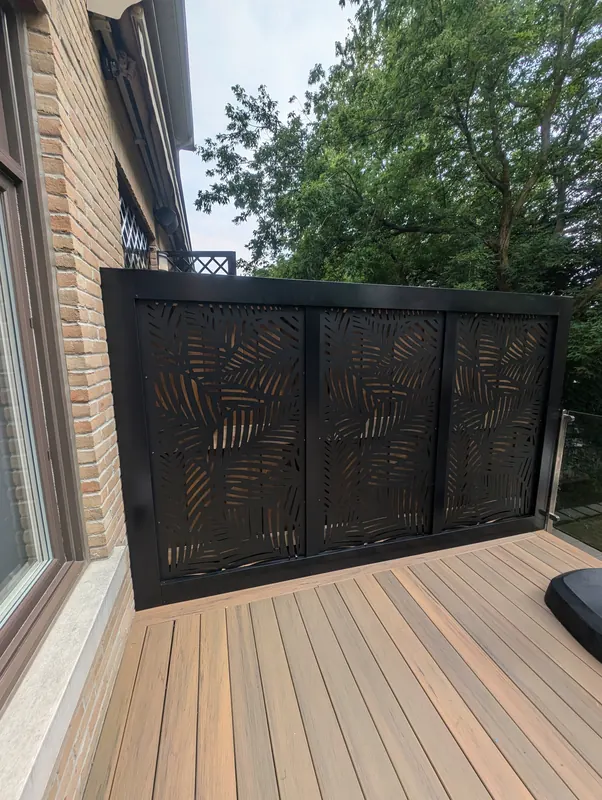 Composite deck detail with decorative black privacy panel