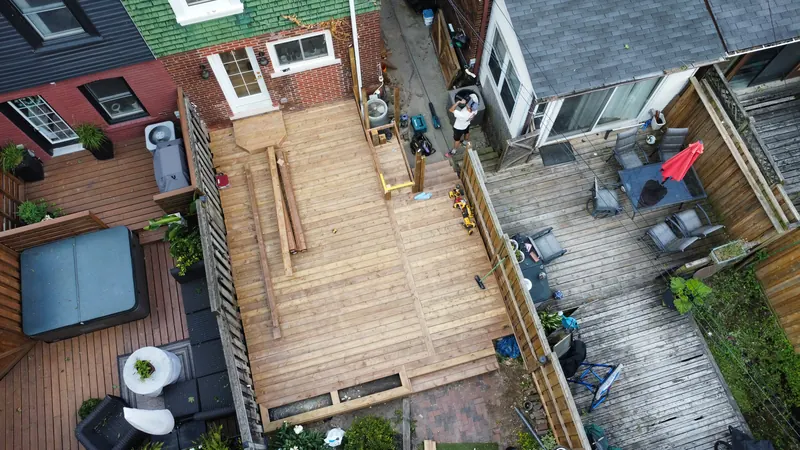 Aerial view of a completed cedar deck spanning a Toronto backyard